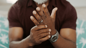 man with arthritis pain in his hands