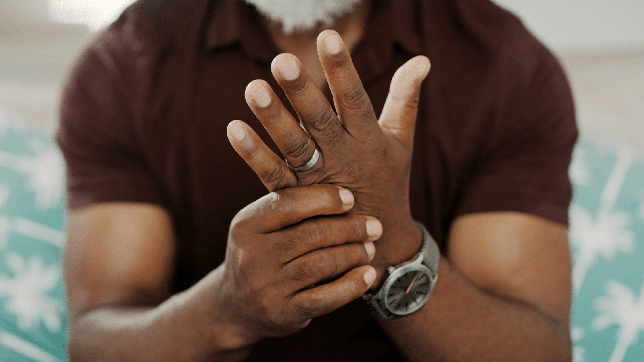 man with arthritis pain in his hands