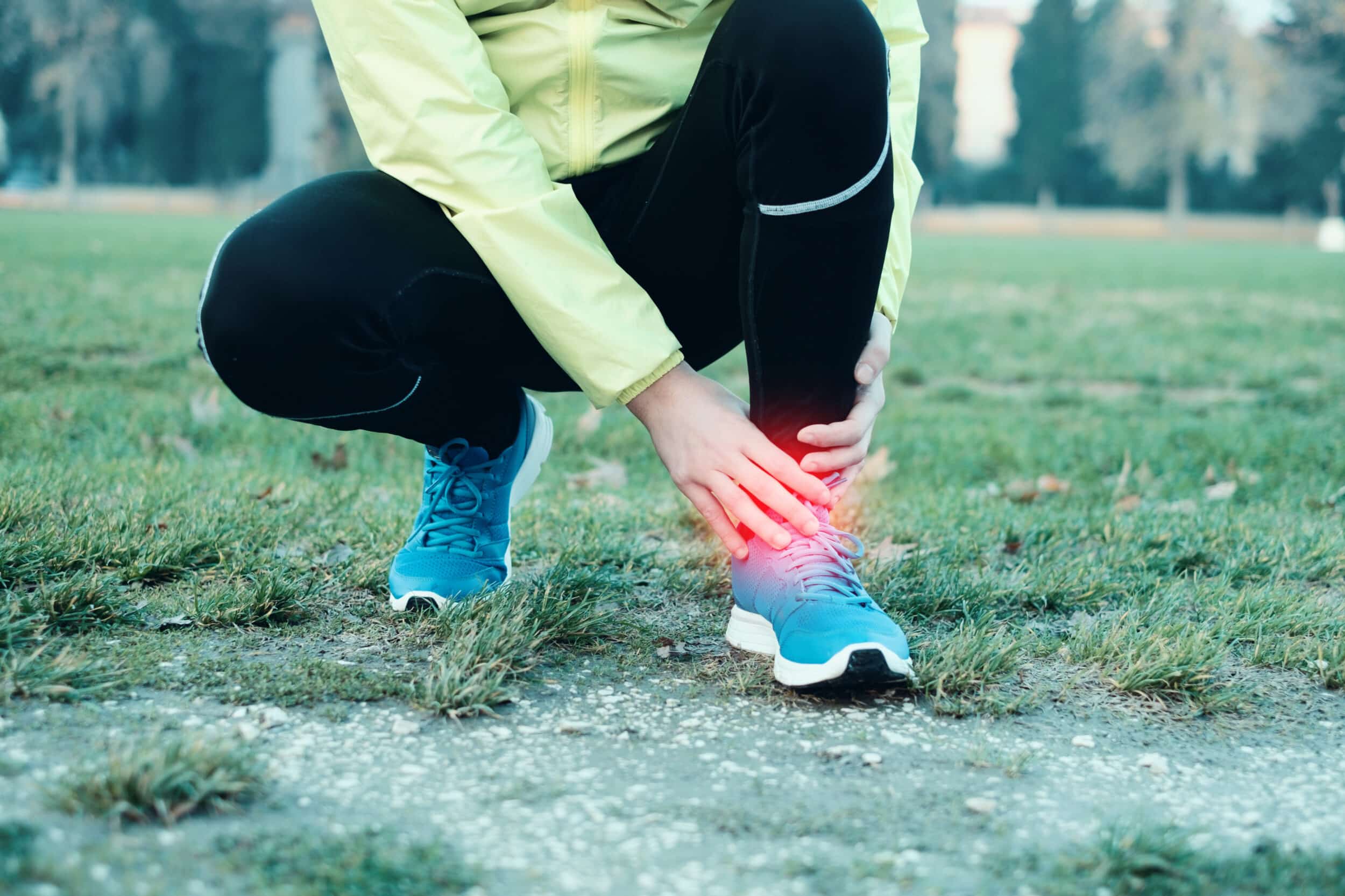 Runner grabs her ankle after suffering a bone fracture